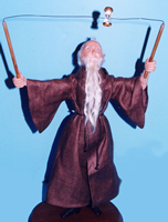 Super Sculpey Doll Father Time juggles with an hourglass